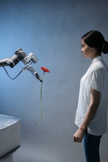 AI पासपोर्ट - a robot giving a woman a flower