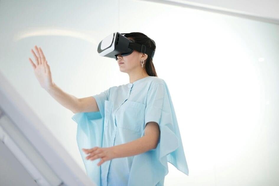 Metaverse Revolution - woman in blue blouse using vr
